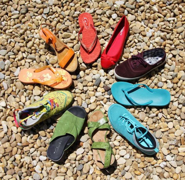 various shoes arranged in a cirlce with the toes on